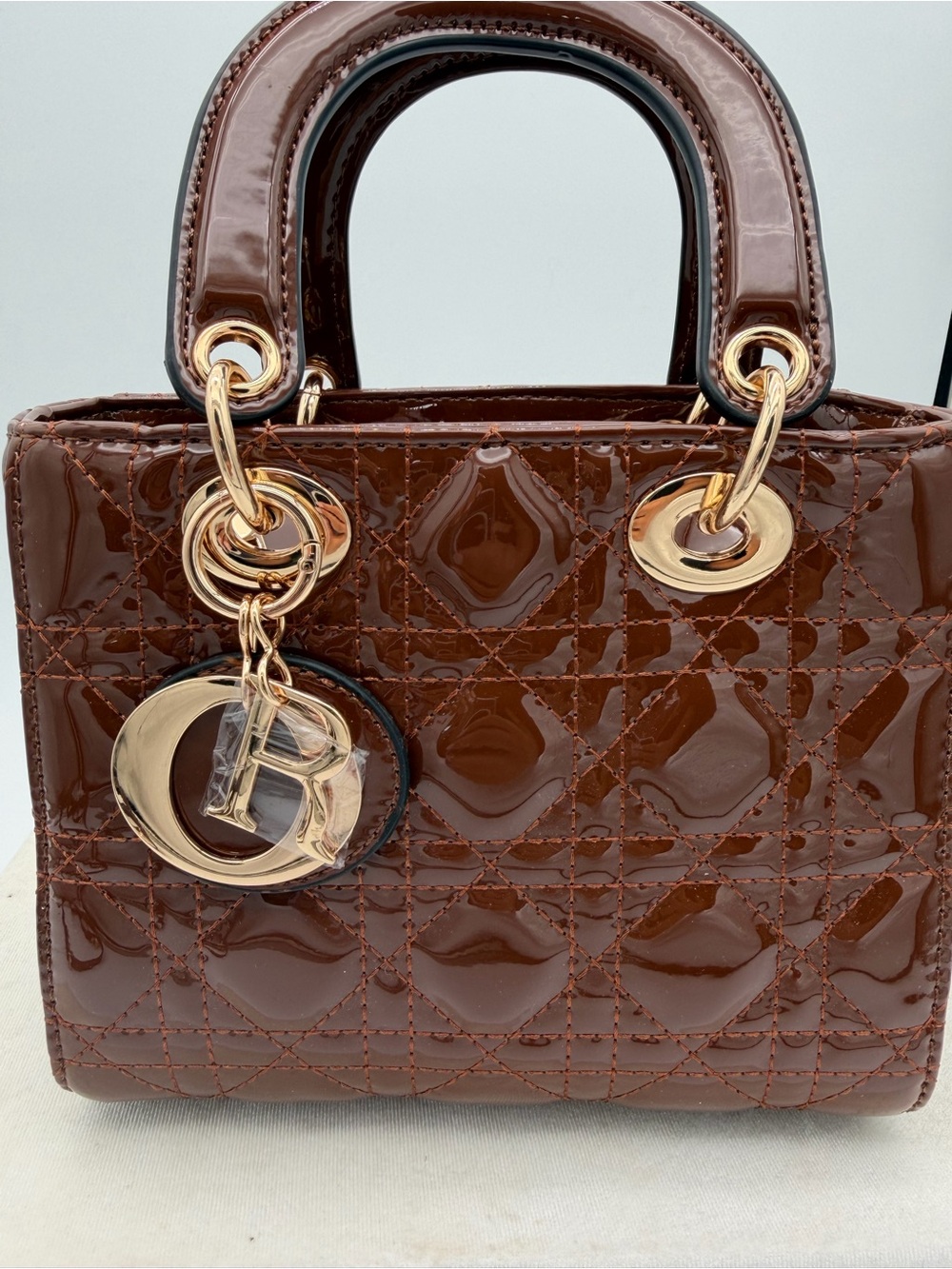 Beautiful, Brown Patent leather mini Bag with Gold Charm - Picture 7 of 15